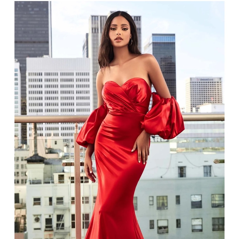 Red gown with detached puff sleeve from Ariela’s Dream.